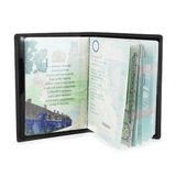 personalised lifetime of adventure passport cover set. one is black. one is cream