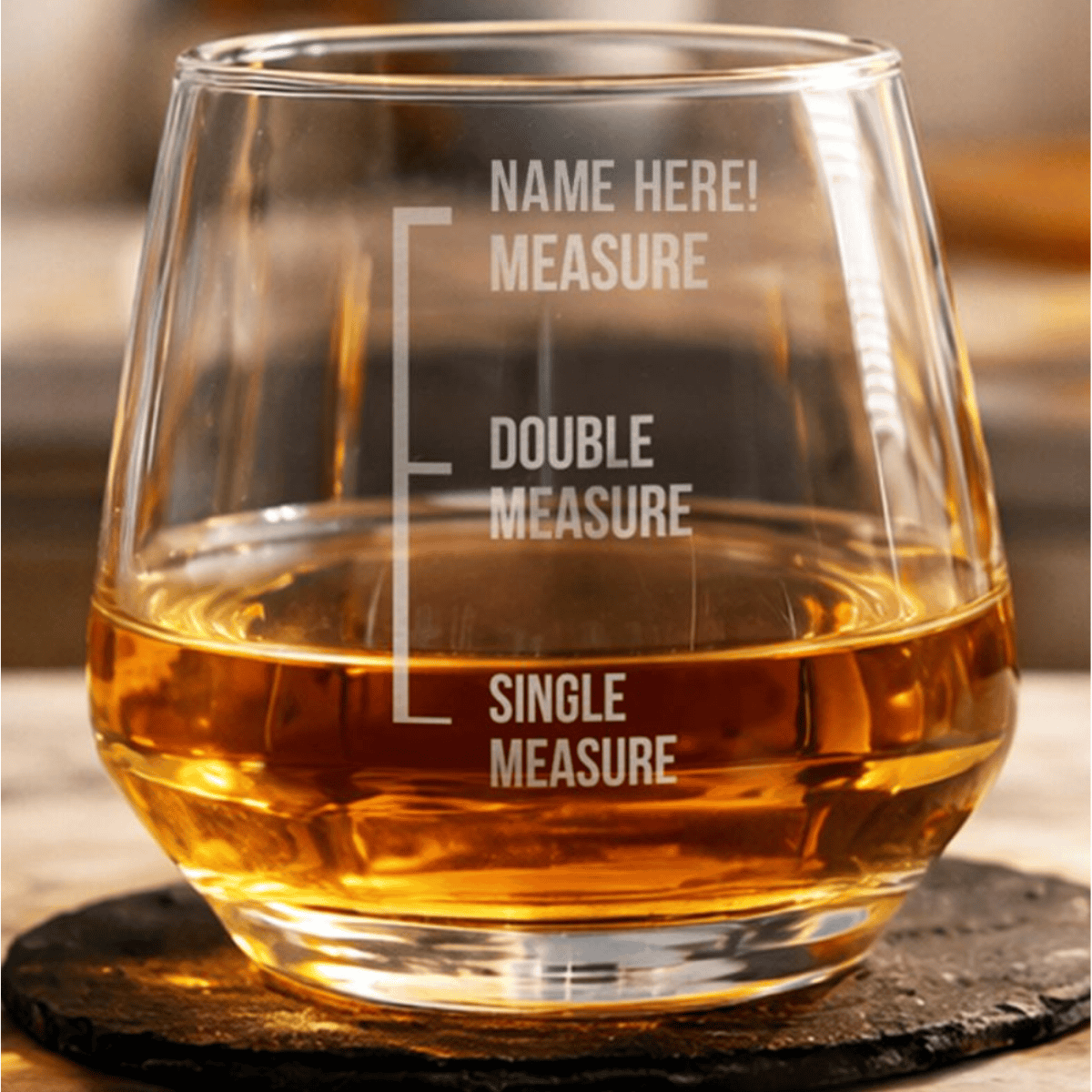 personalised glass whisky tumbler showing the name engraved on the glass