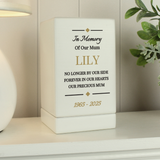 personalised white wooden urn with the personalisation on the front in black and gold writing