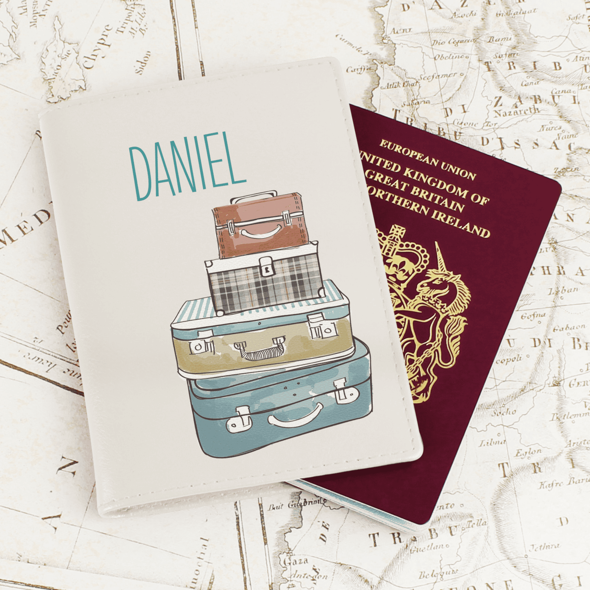 personalised cream passport holder with a suitcase design on the front and any name personalised at the top