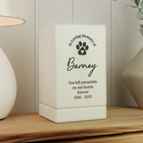 personalised wooden white pet urn showing a black paw print on the front and the personalisation over 5 lines