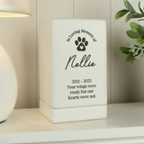 showing a black paw print on the front and the personalisation over 5 lines