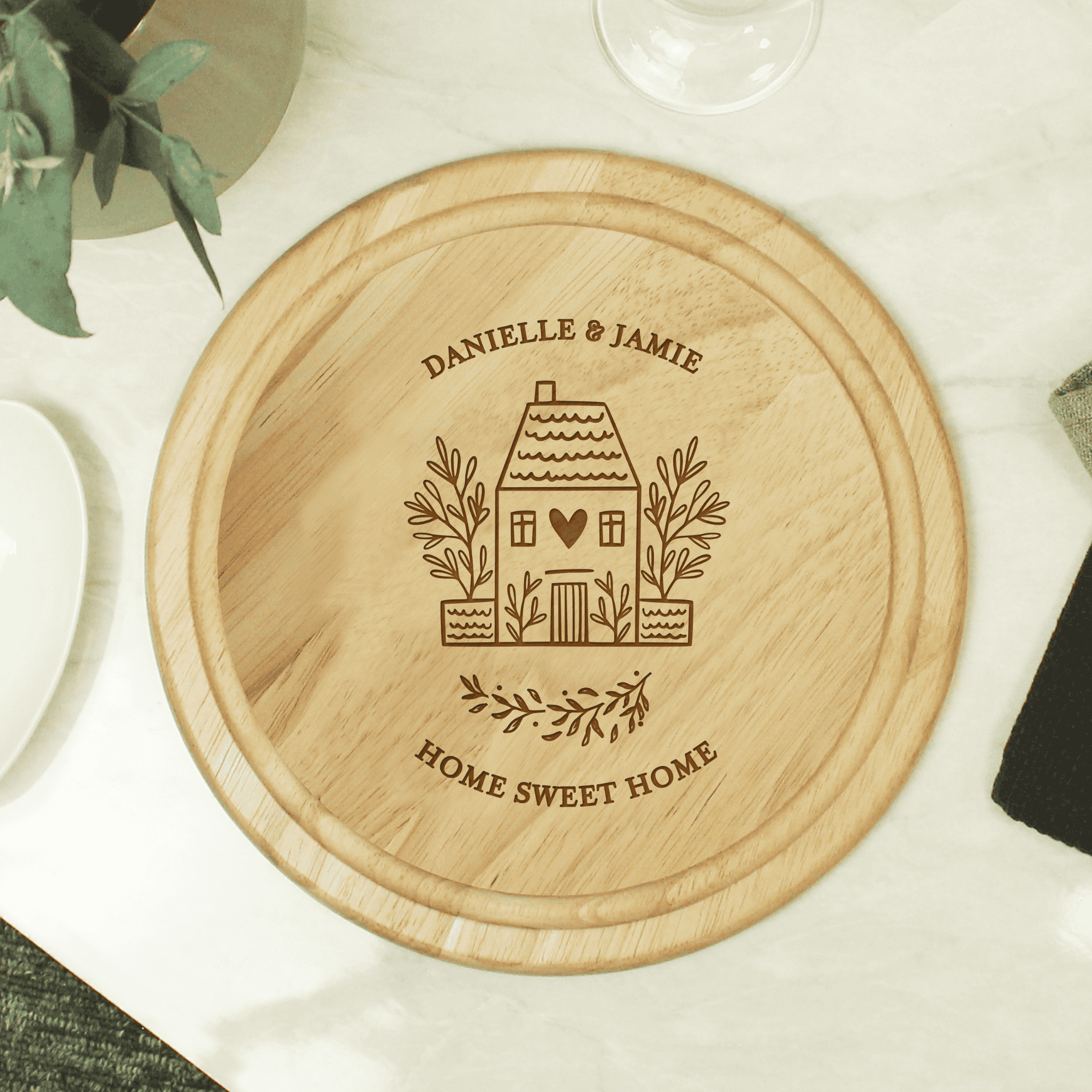 personalised round wooden HOME chopping board engraved with a message over 2 lines