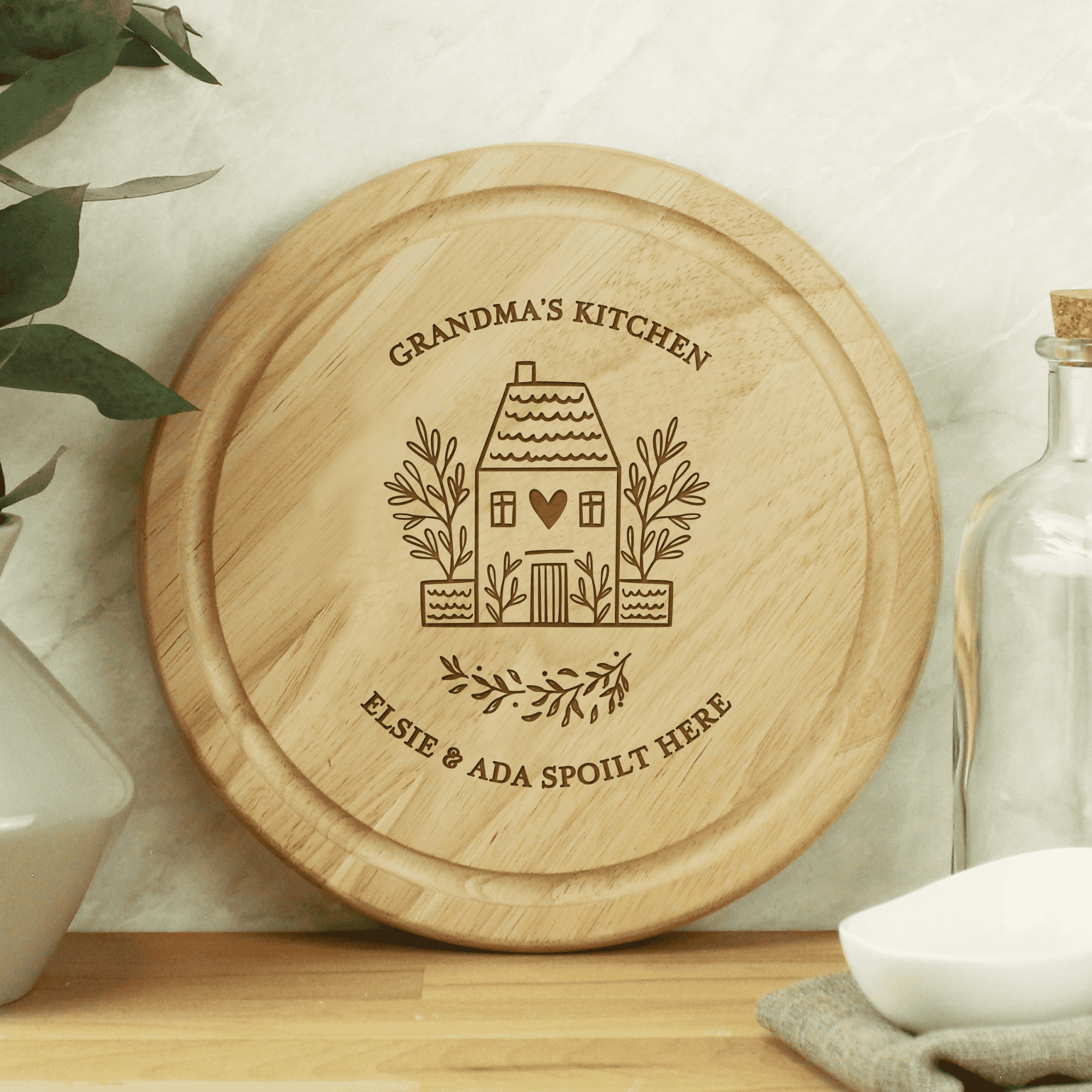 personalised round wooden HOME chopping board engraved with a message over 2 lines