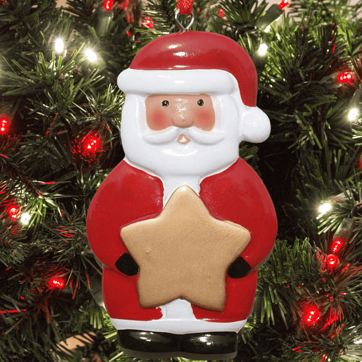 personalised santa christmas tree decoration. The gold star that Santa is holding can be personalised with any name.