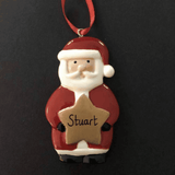 personalised santa christmas tree decoration. The gold star that Santa is holding can be personalised with any name.