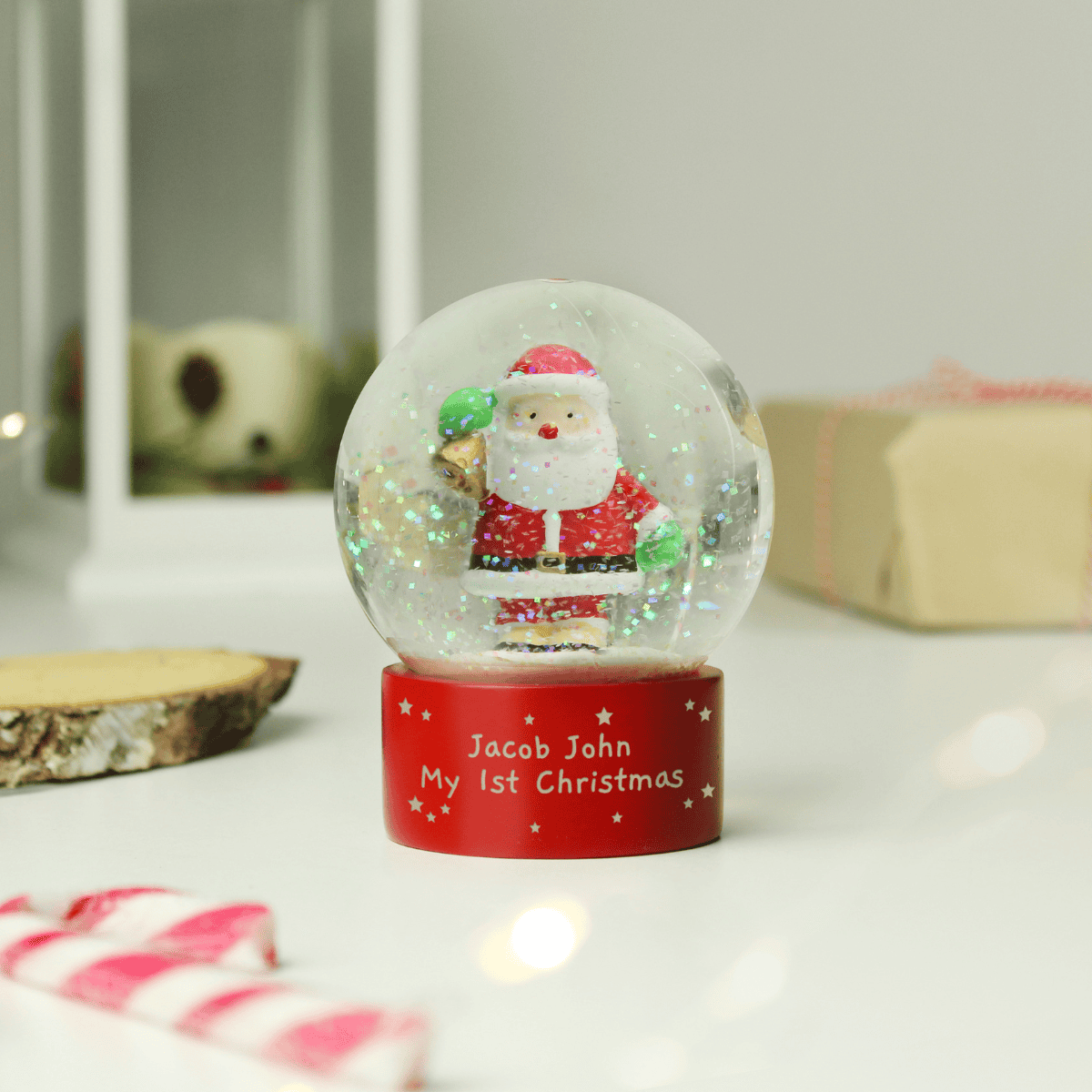 personalised santa snow globe showing the personalisation on the front