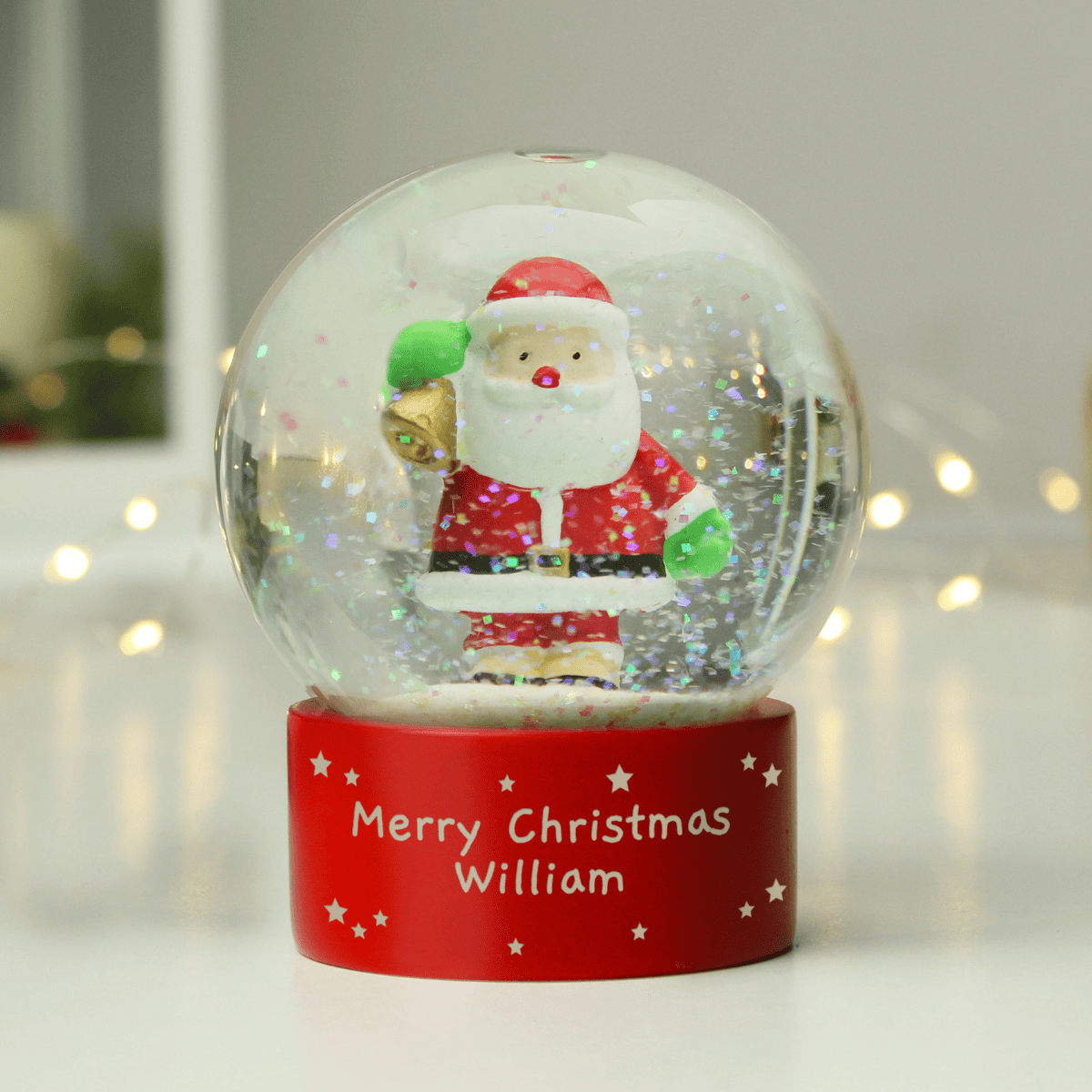 personalised santa snow globe showing the personalisation on the front