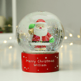 personalised santa snow globe showing the personalisation on the front