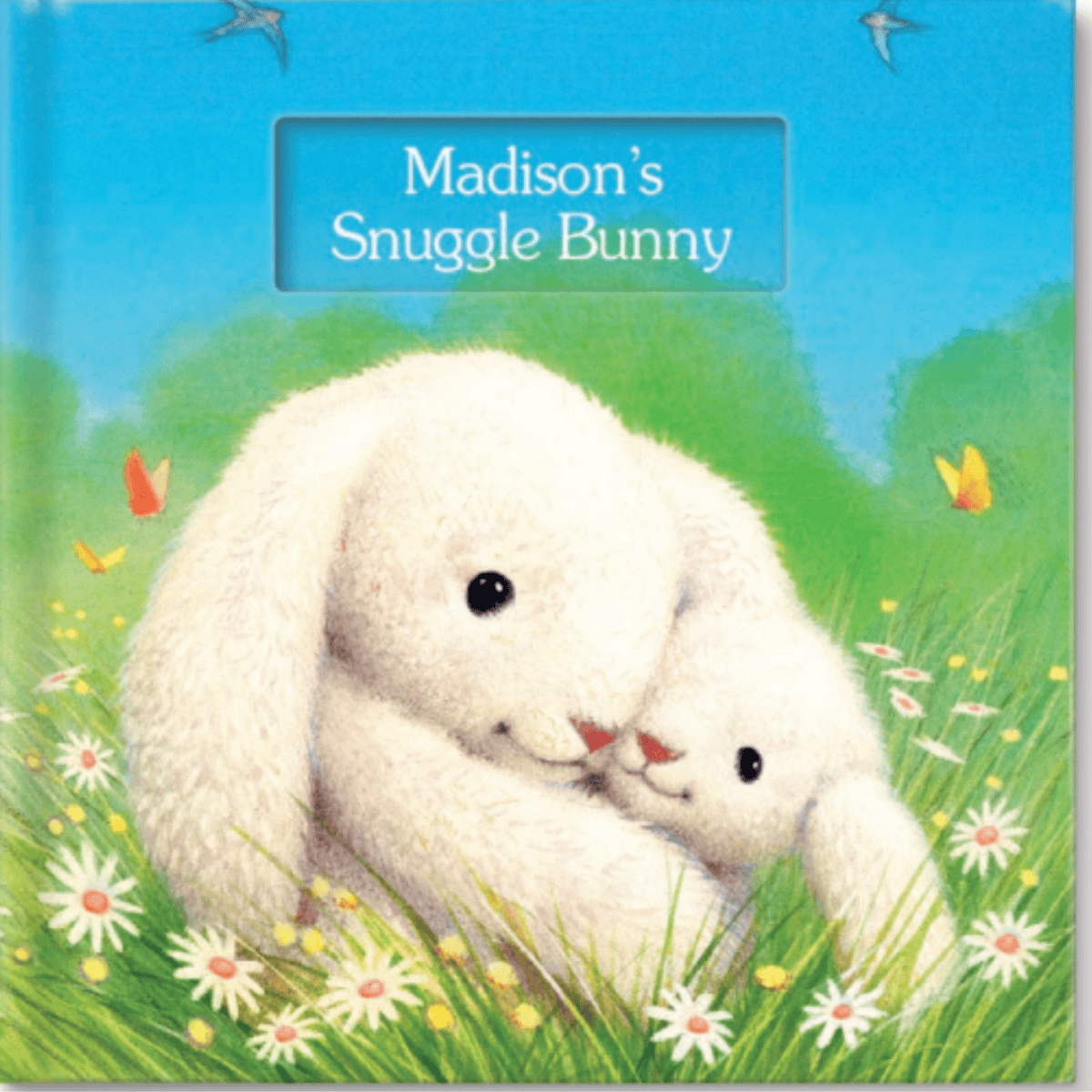 Book cover with two white bunnies snuggling in a grassy field with flowers and butterflies, titled 'Madison's Snuggle Bunny'.