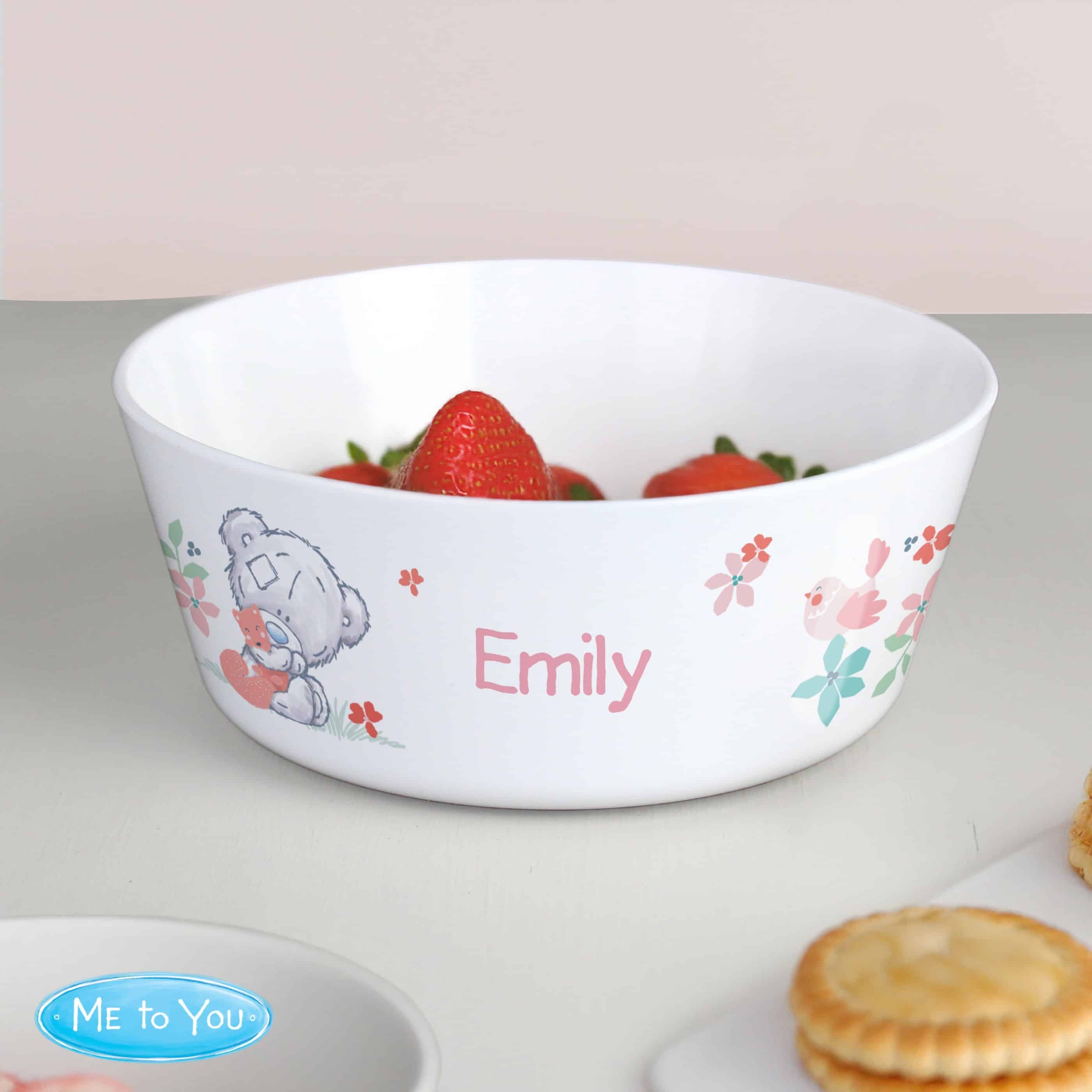 personalised Tiny Tatty plastic children's bowl with their name on the front and a design at either side of it.