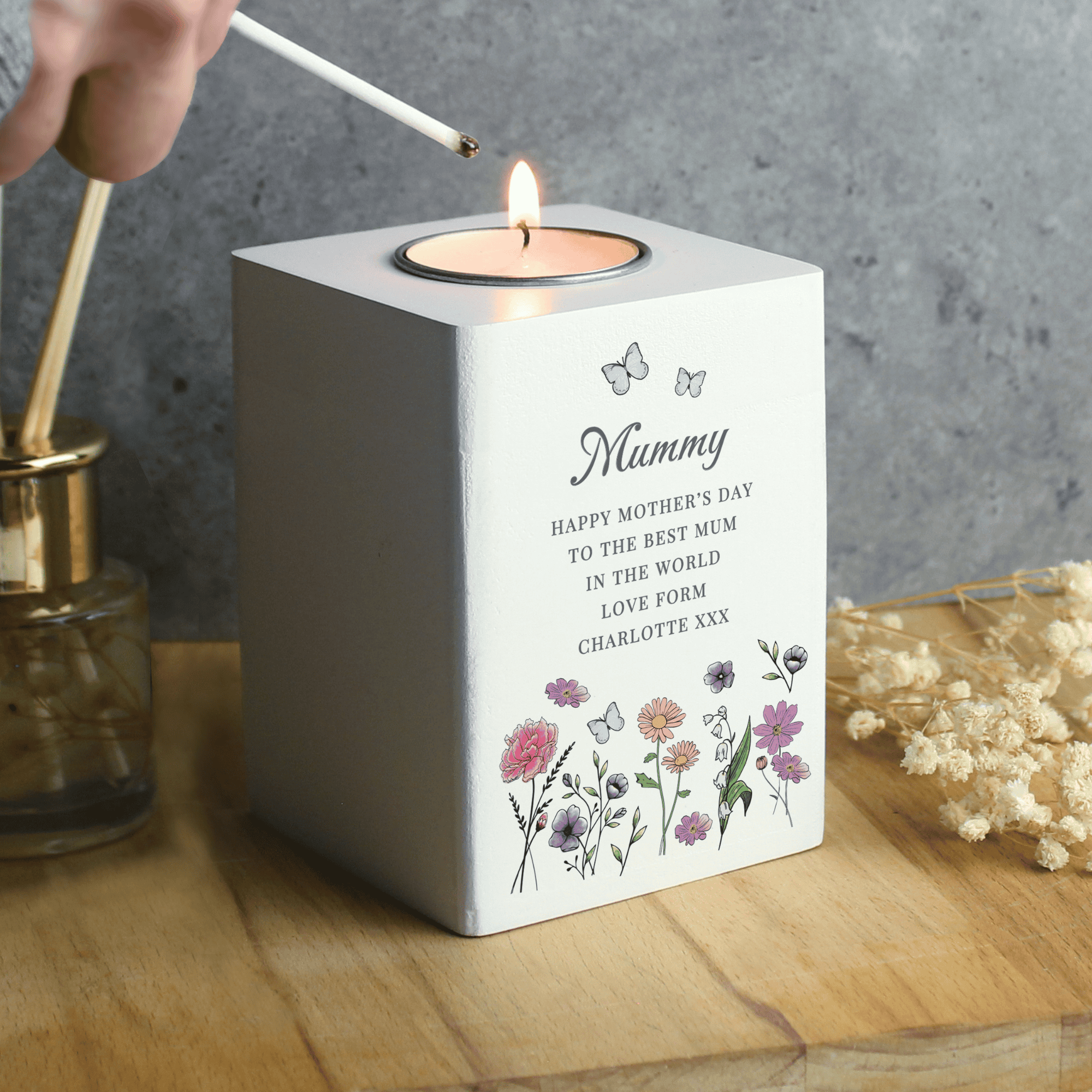 tealight holder with a wild flowers design personalised with a name in larger font and any message over 6 lines