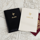 Personalised gold letter passport covers. one is black one is cream