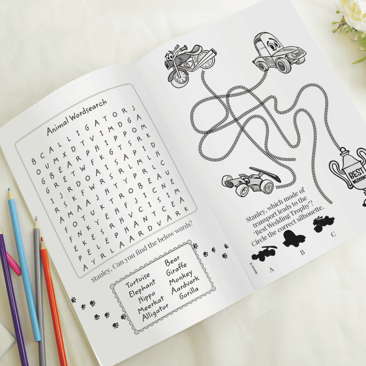 personalised pink acitivity book showing the inside of the book with the child's name personalised on every page