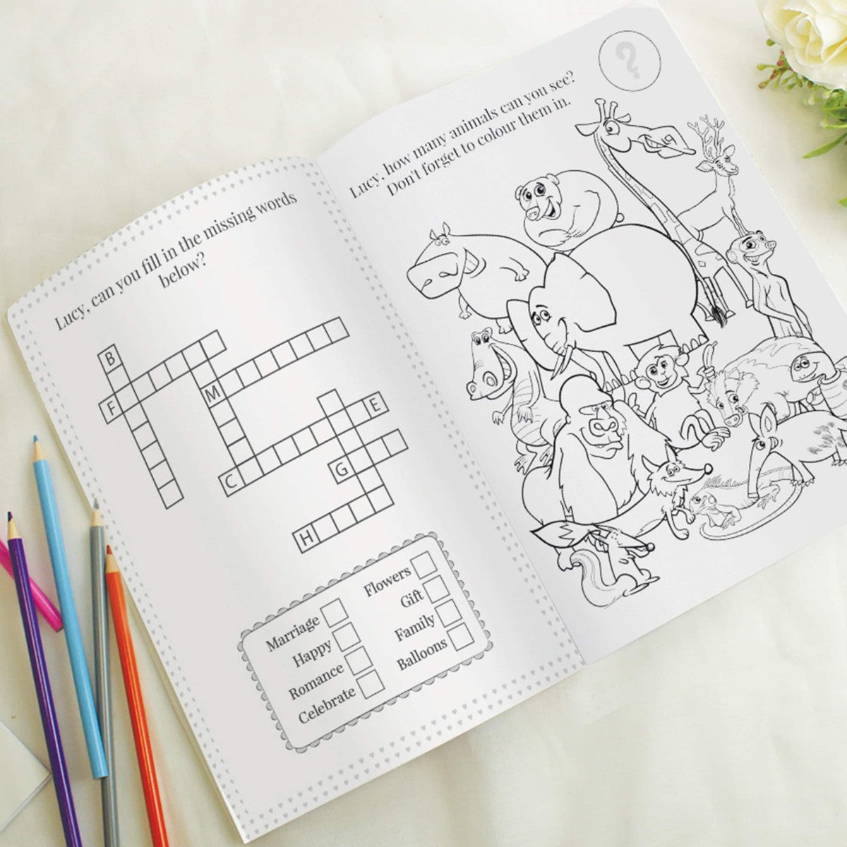 personalised pink acitivity book showing the inside of the book with the child's name personalised on every page
