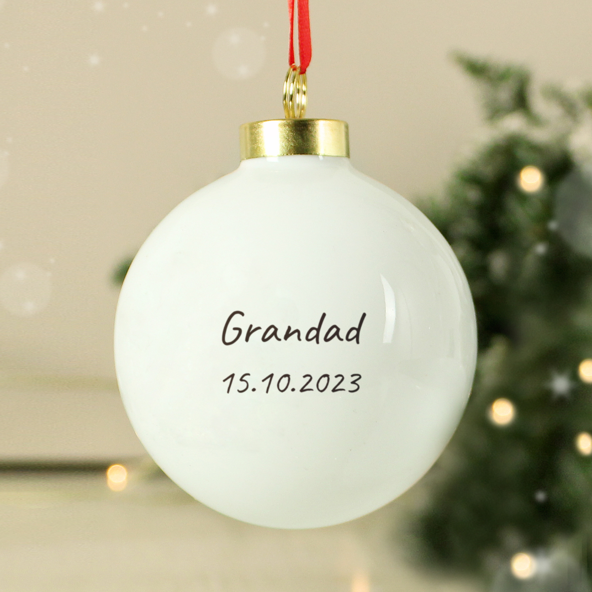 personalised ceramic robin memorial bauble showing the personalisation on the back