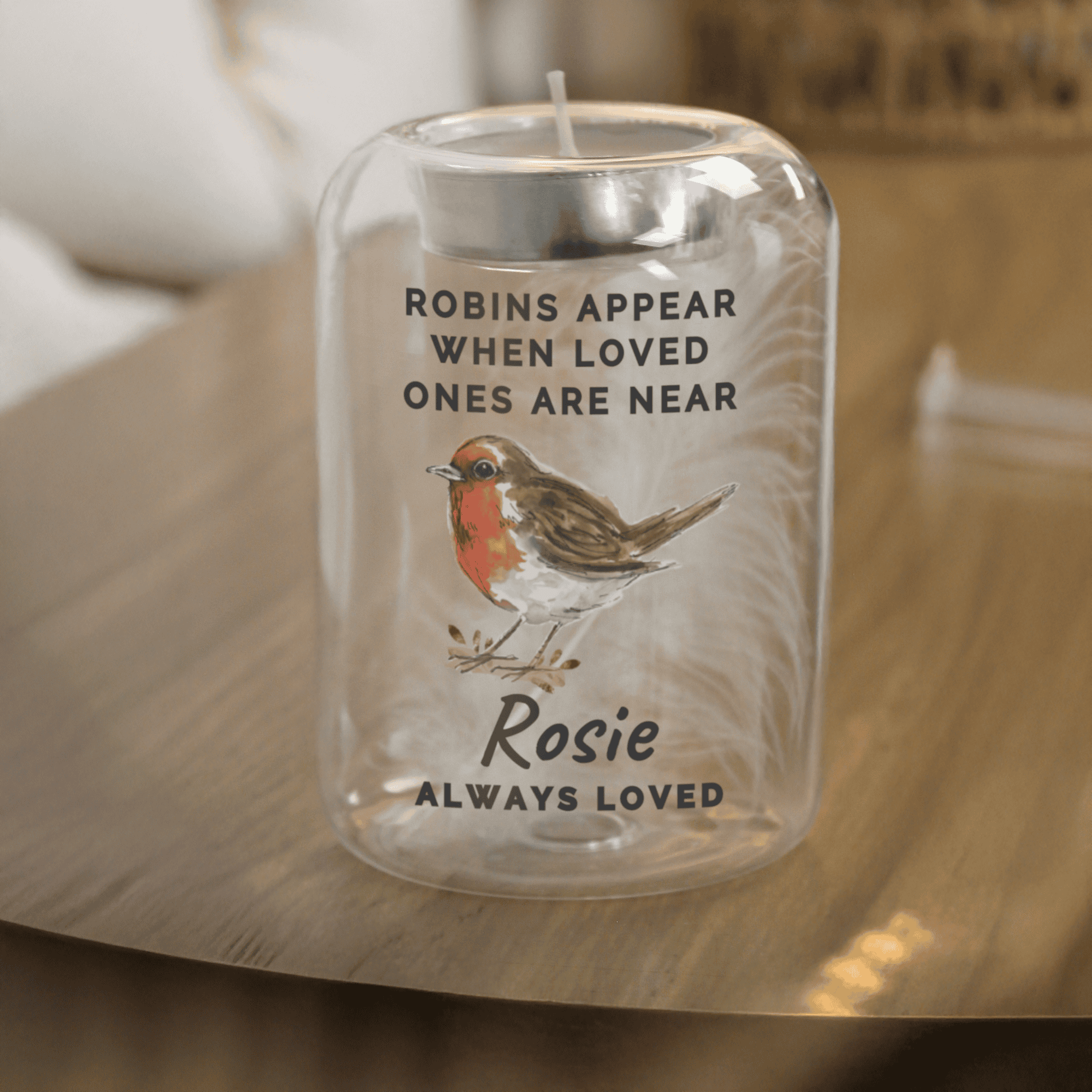 personalised robins appear memorial glass tealight holder with a feather in the centre