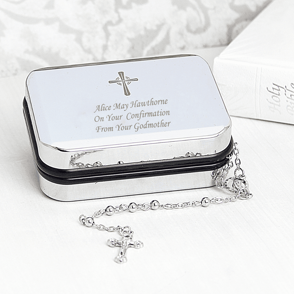 catholic rosary beads and trinket box showing the engraving of the chosen message on the front