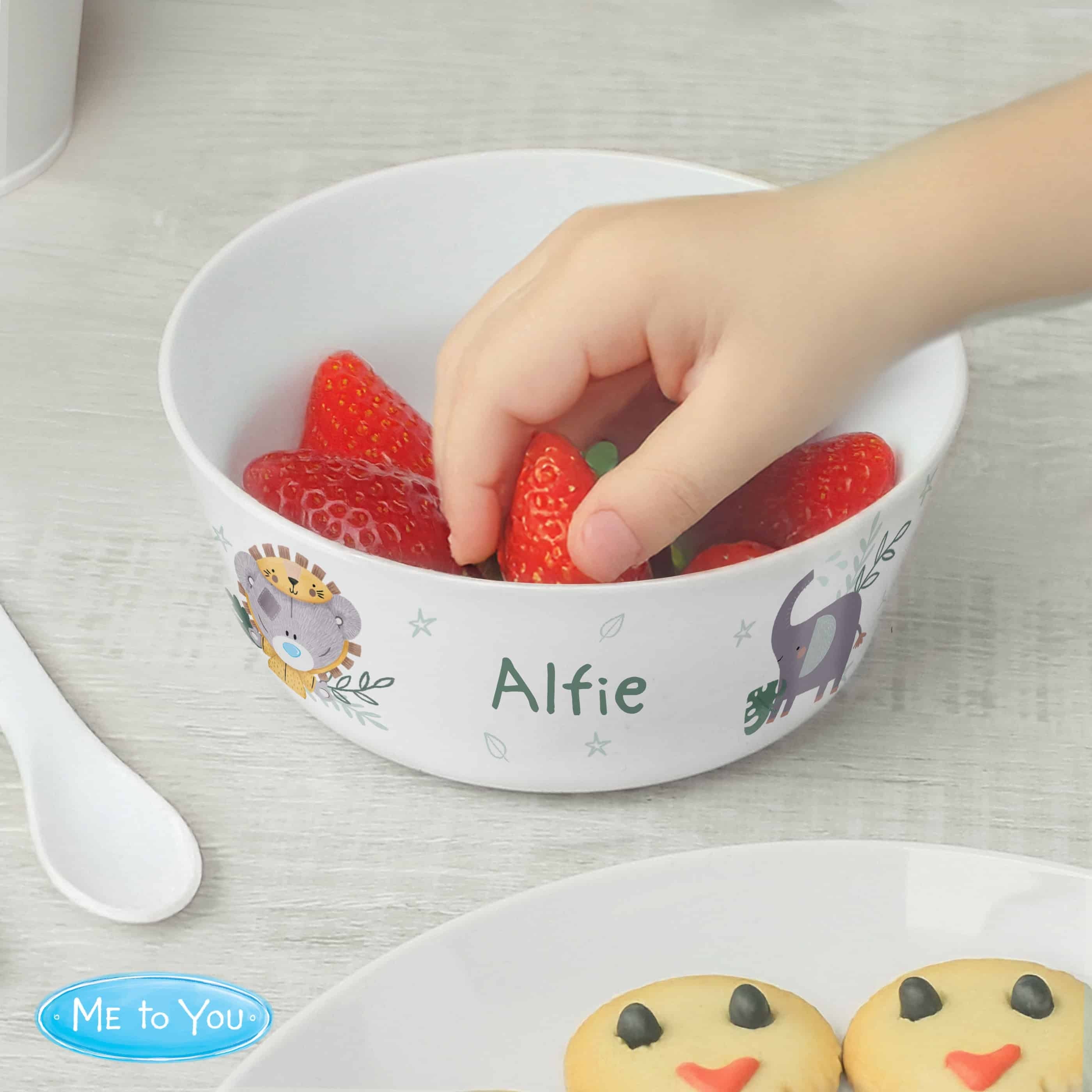 personalised Tiny Tatty plastic children's bowl with their name on the front and a design at either side of it.