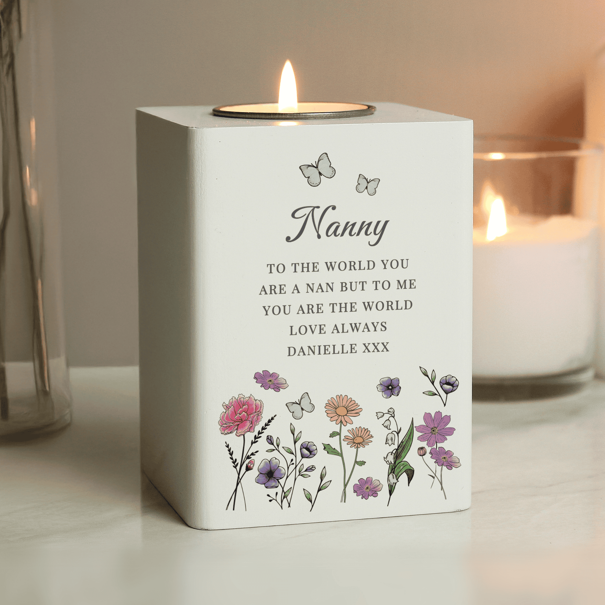 tealight holder with a wild flowers design personalised with a name in larger font and any message over 6 lines