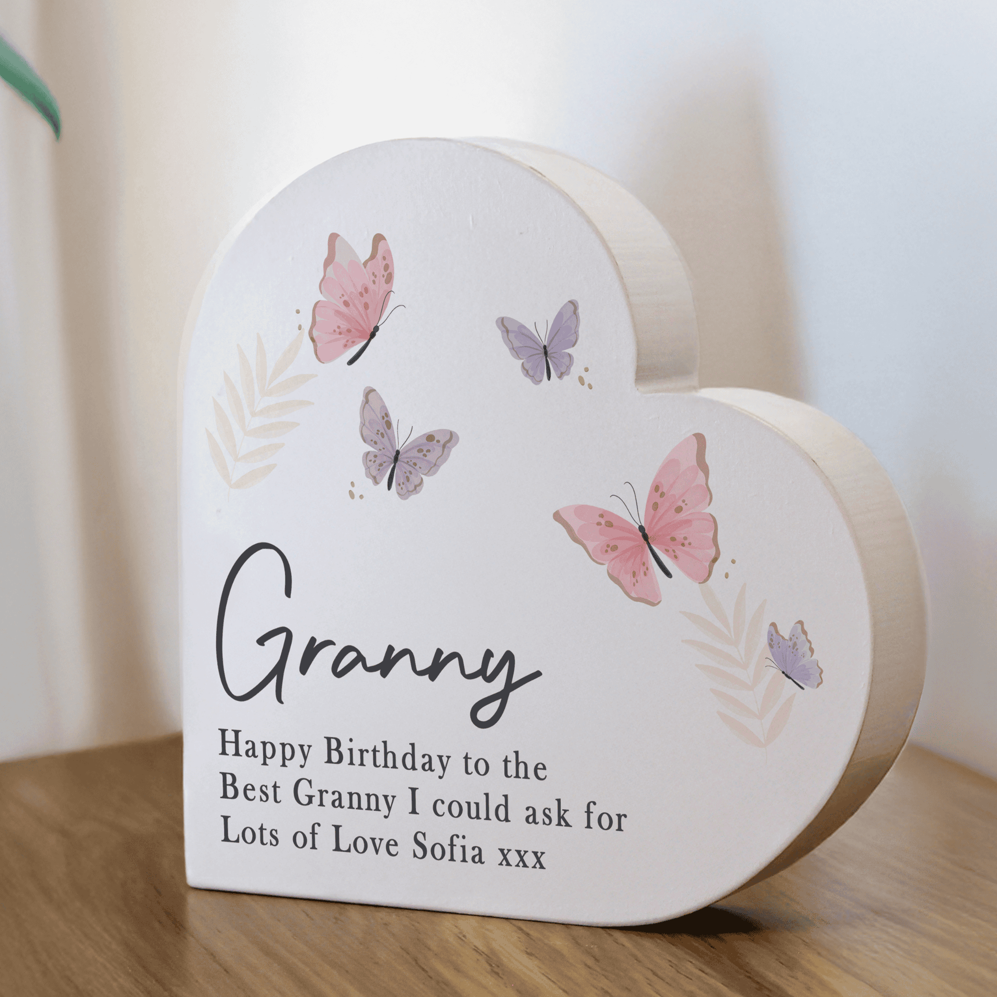 personalised butterfly wooden ornament in a heart shape personalised with a name and any message over 3 lines